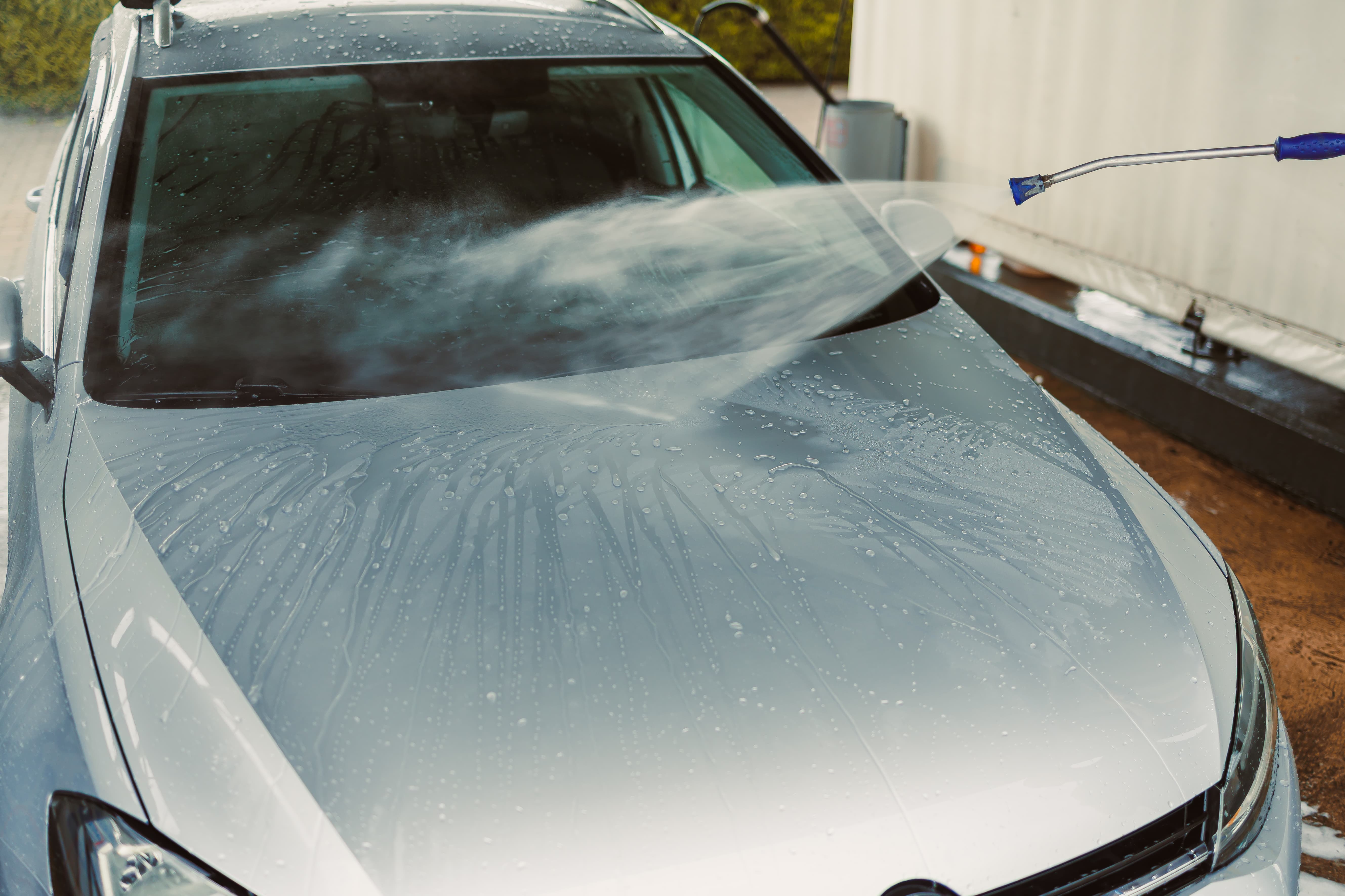 Vehicle being rinsed during a mobile detail